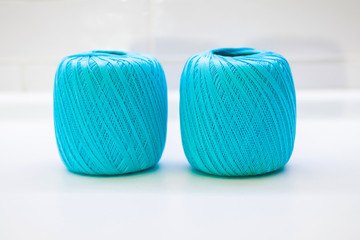 Woolen ball made of thread and knitting needles