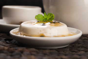 Panna cotta dessert with passion fruit and mint