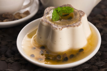 Panna cotta dessert with passion fruit and mint