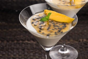 Panna cotta dessert with passion fruit and mint