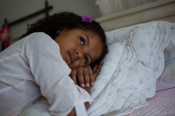 Girl lying on a bed in the bedroom