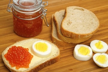 Sandwich with red caviar and egg in various angles