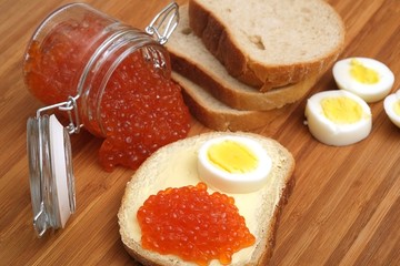 Sandwich with red caviar and egg in various angles