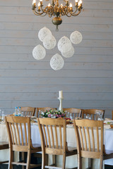 Festive table with chairs outside. Interior Banquet space.