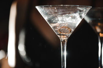 A martini glass with a ring