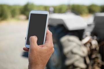 Hand using mobile phone