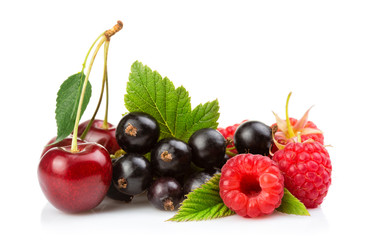 Various fresh summer berries (cherry, raspberry, black currant) isolated