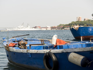 a nice boat moored in the ancient port of old taranto, in the south of italy