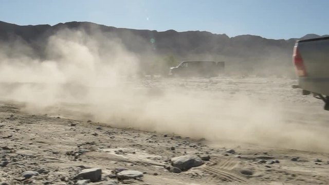 4x4 truck driving through dirt