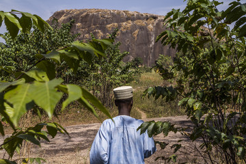 Fulani elder showing the way to his village