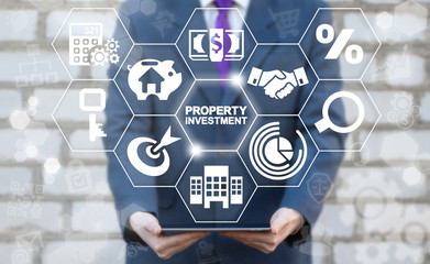 Property Investment Finance Business Concept. Real estate. Man offers tablet computer with Property...