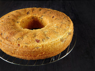 Close-up of a basic sponge cake. A cake is prepared to be decorated on a dark background
