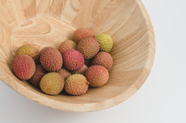 lychee fruit in a wooden bowl, white background - 162773039