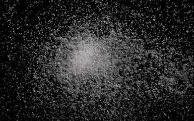 White sugar closeup isolated on black background and texture, top view