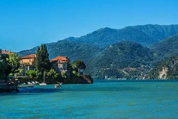 Fototapeten Beautiful view of picturesque Lake Como - a very popular tourist attraction. Lombardy, Italy. © dbrnjhrj
