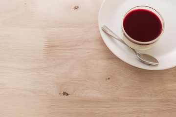 panna cotta on white plat wood table