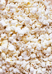 White fluffy movie theater popcorn background, top view