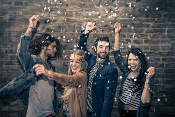Group of young adults hanging around in a disco club
