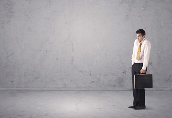 Fototapeta premium Young businessman standing confused
