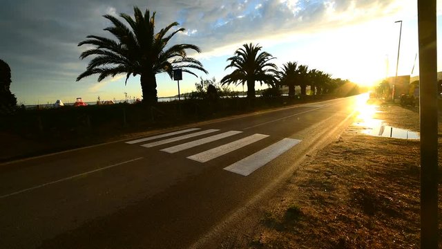 Urban road at sunset in Alghero. Sardinia, Italy