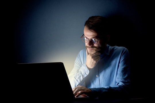 Businessman in the office at night