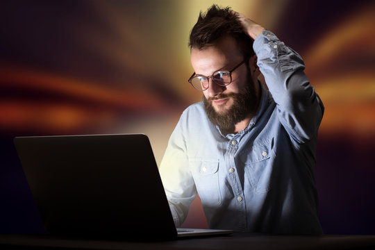 Businessman in the office at night