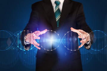 Businessman holding DNA