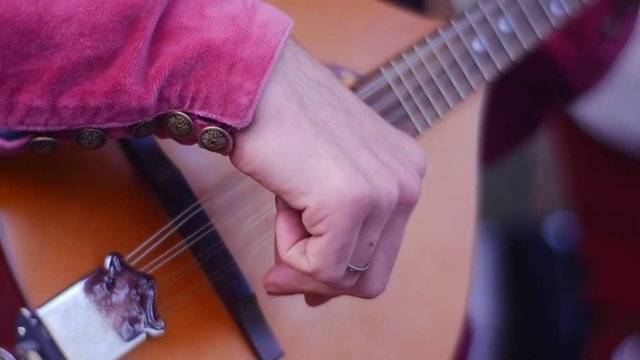 Guitarist Extracts Sound From Musical Instrument