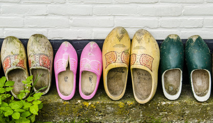 Wooden shoes against a Wall