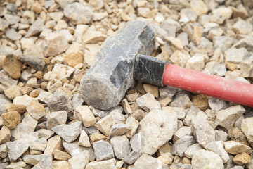 Sledge hammer on rubble
