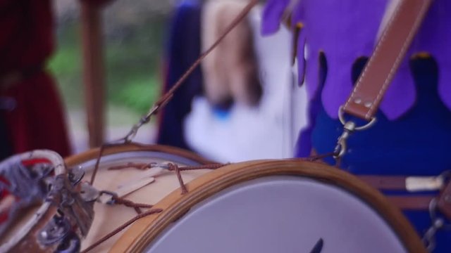 Woman Plays an Ethnic Music on Drum With Bells