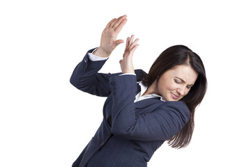Portrait woman office worker. Protects herself with her hands. Closing face isolated on white background