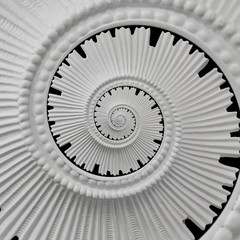 White black stucco moulding plasterwork spiral abstract fractal pattern background. Plaster abstract spiral effect background. Spiral abstract background. Decorative stucco element concept fractal