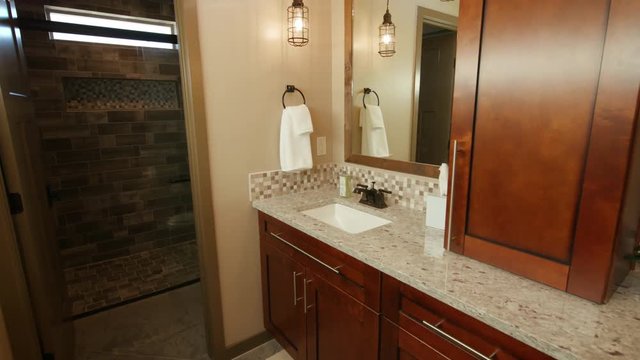 Corner of Double Sink Bathroom Modern Sun Flare Rising. shot rises on corner of tight master bathroom corner with entrance to shower
