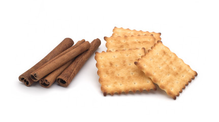 Fototapeta na wymiar Crackers and cinnamon sticks on a white background
