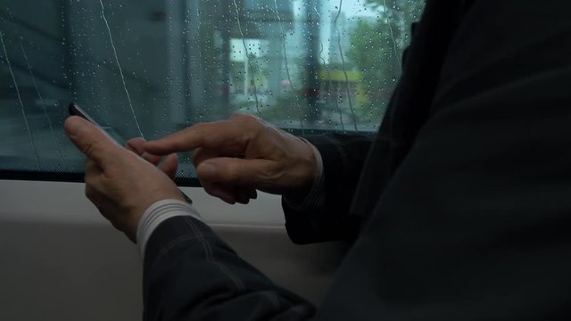 Elderly Man Passenger Travel On Train And Text Messaging On Mobile Phone