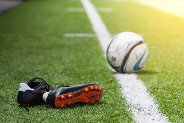 Shoes with blurred soccer ball