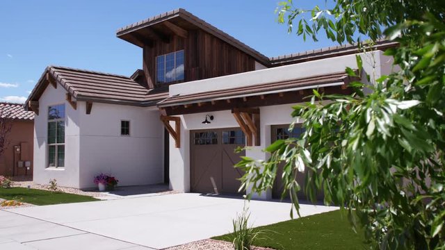 Southwest White Home Exterior Rising Daytime. shot rises during the daytime on a southwest white home in suburban new mexico
