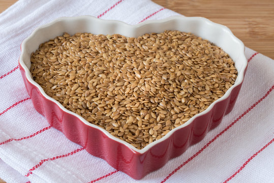 Whole Flaxseeds in a Heart Shaped Bowl