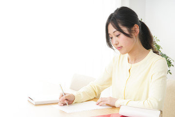 Young woman studying at home