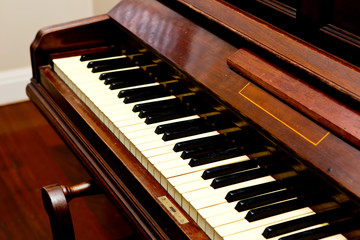 Fototapeta na wymiar Antique Piano - piano keys angled view
