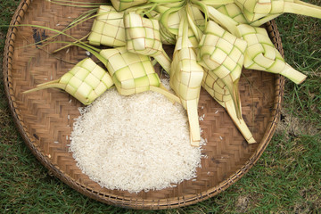 Ketupat in the bamboo basket. Made of rice wrapped in coconut leaves before boiling until cooked. Regular meals, especially among the Malay community. Eid fitr Concept