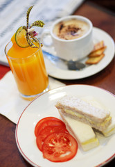 Sandwich with orange juice and coffee