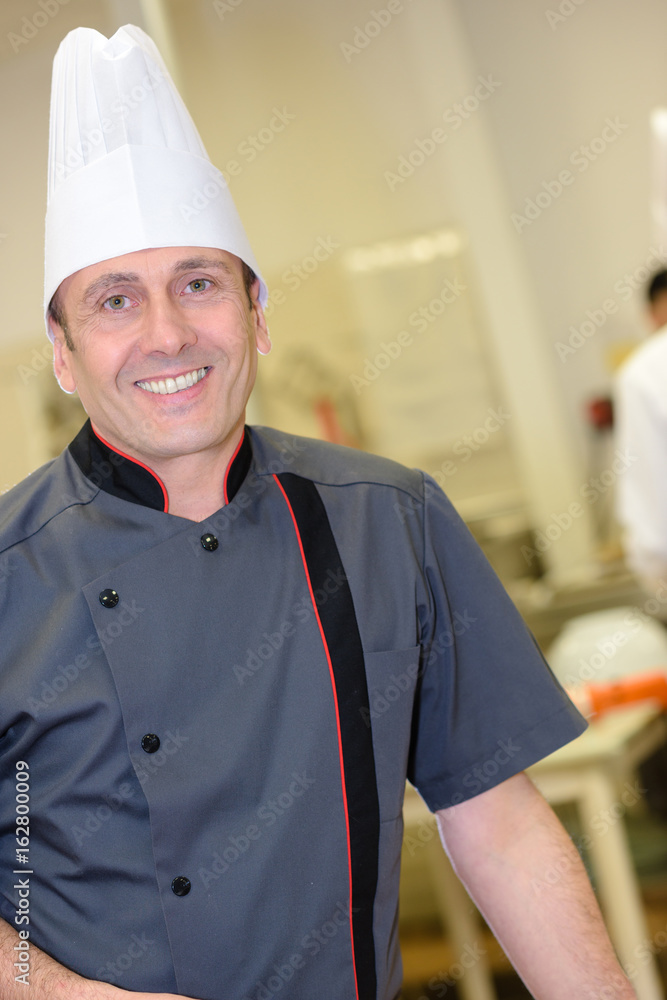 Wall mural confident chef smiling