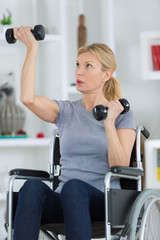 Fototapeta premium disabled woman exercising at home