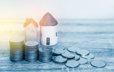 Mortgage concept by money house from coins, ,finance and loan background concept.