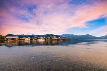 Lake Maggiore, colorful sky, northern Italy. Enchanting view of the city of Arona, province of Novara, Piedmont side of Lake Maggiore