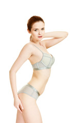 Obraz premium Attractive slim woman in grey matching underwear