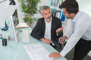 architects working on a construction plans together