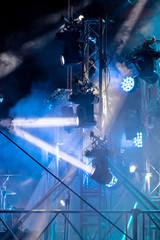 LED spotlights with blue rays in smoky dark. stage illumination equipment